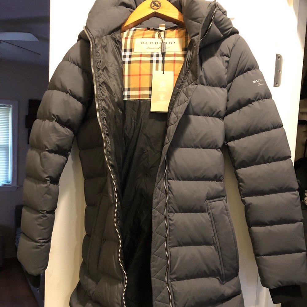 A woman’s Burberry coat size small new with tags